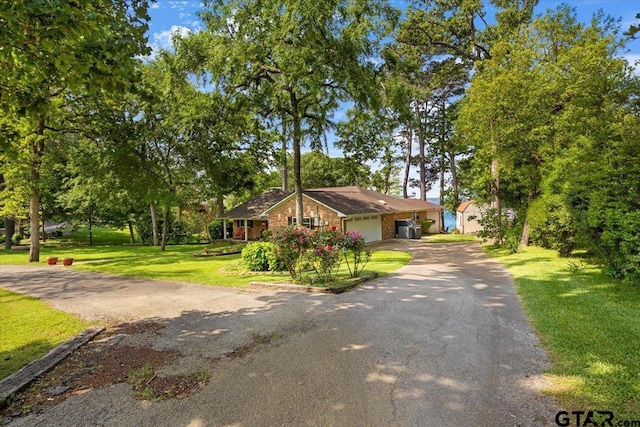 23324 Bay Side Dr, Bullard, TX 75757 - single story home featuring an attached garage, driveway, a front lawn, and brick siding