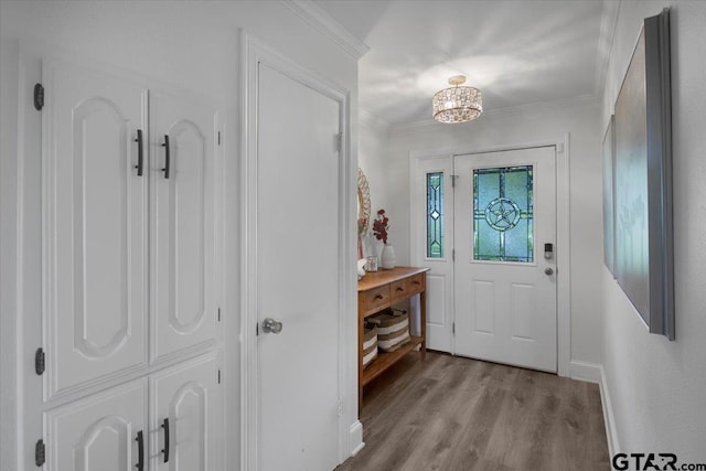 23324 Bay Side Dr, Bullard, TX 75757 - foyer entrance with wood finished floors, crown molding, and a chandelier