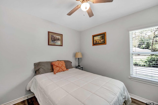 bedroom featuring hardwood / wood-style flooring and ceiling fan