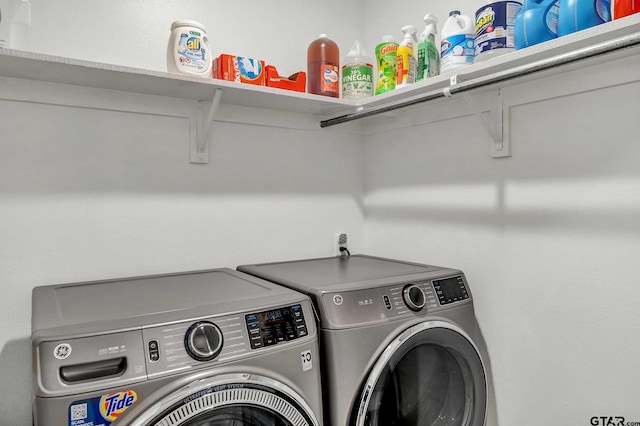 laundry room with separate washer and dryer