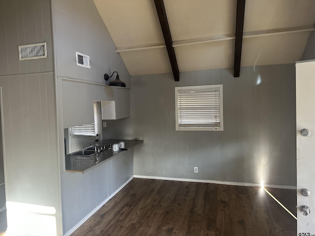 kitchen featuring lofted ceiling with beams and dark wood-type flooring