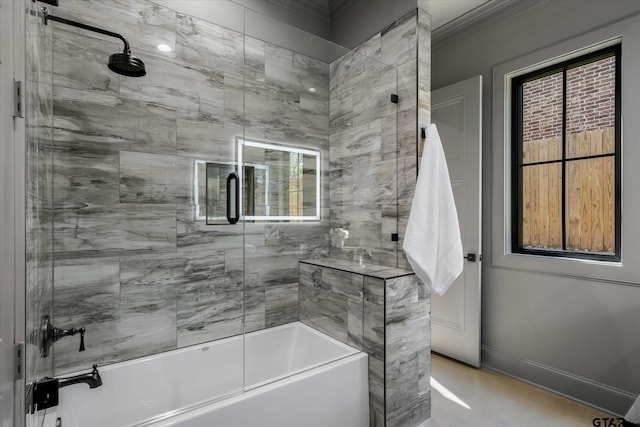 bathroom with plenty of natural light and shower / bath combination with glass door