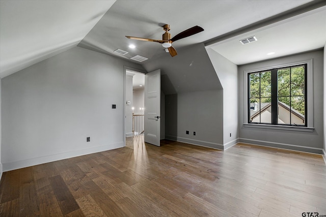 bonus room featuring ceiling fan, lofted ceiling, and hardwood / wood-style floors