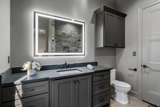 bathroom featuring vanity, toilet, crown molding, and an enclosed shower