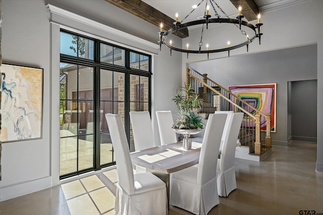 dining room with beamed ceiling, a high ceiling, and a chandelier