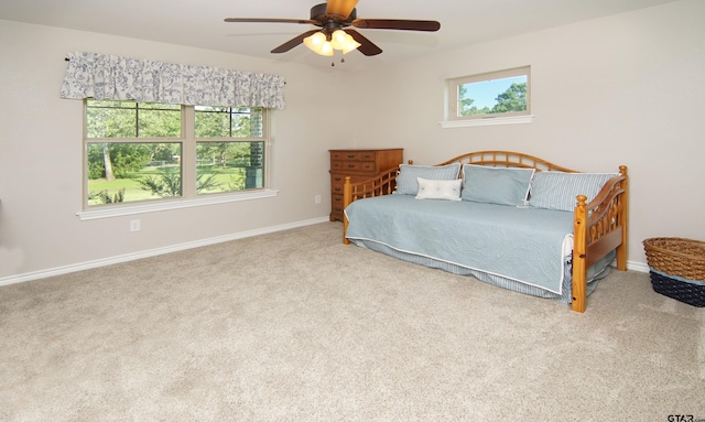 bedroom with baseboards, carpet, and ceiling fan