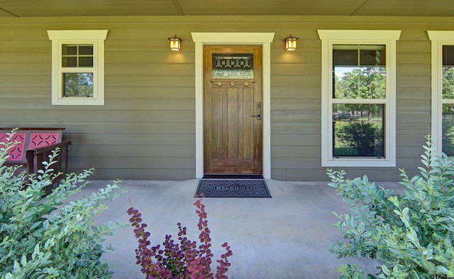 doorway to property with a porch