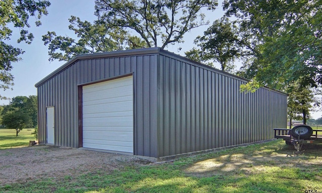 detached garage featuring driveway