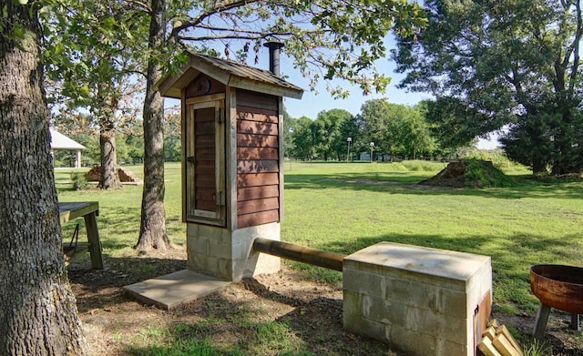 view of outbuilding with a lawn