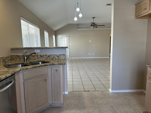 kitchen with dishwasher, light brown cabinets, sink, light stone counters, and light tile patterned floors