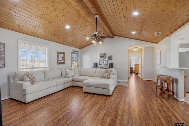 living room with lofted ceiling with beams, ceiling fan, hardwood / wood-style floors, and wood ceiling