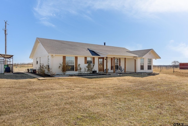 single story home with a front yard and covered porch