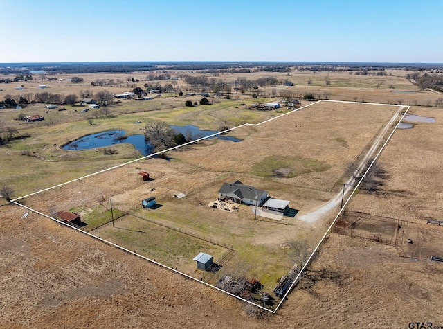 drone / aerial view with a water view and a rural view