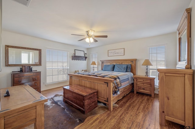 bedroom with dark wood-type flooring and ceiling fan