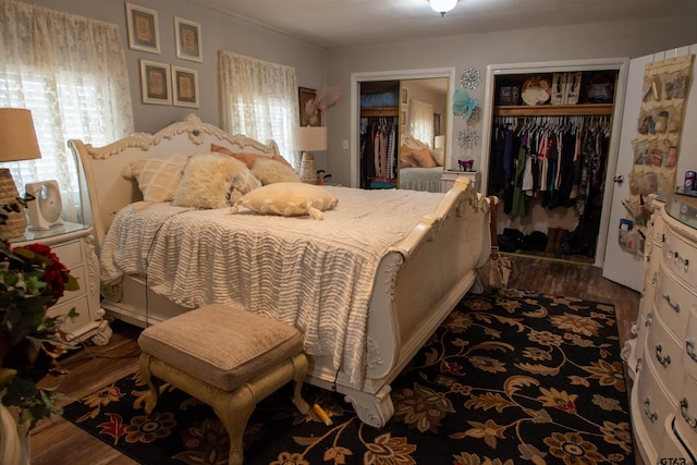 bedroom with hardwood / wood-style flooring