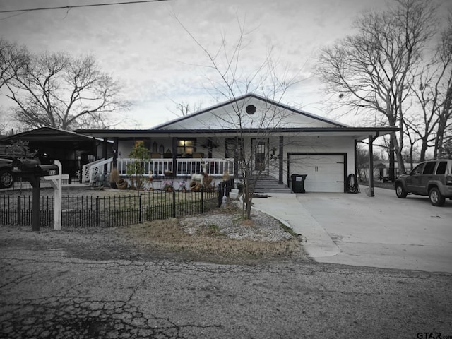 view of front of home with a garage and covered porch