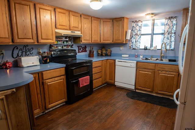 kitchen featuring sink, white appliances, and dark wood-type flooring