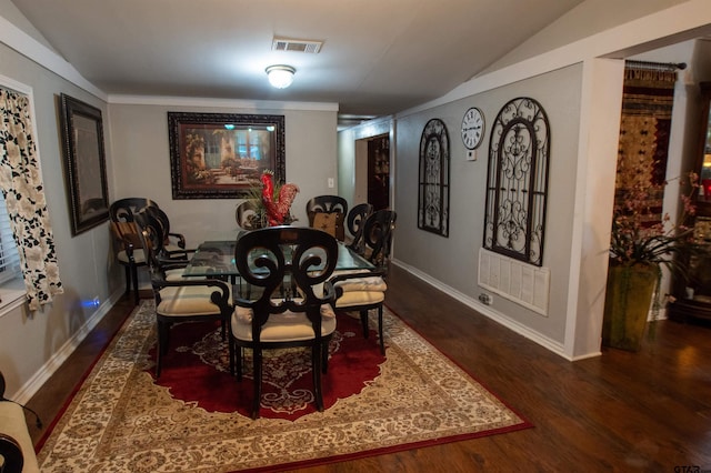 dining area with lofted ceiling and dark hardwood / wood-style floors