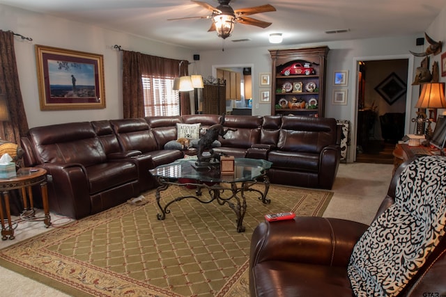 carpeted living room featuring ceiling fan