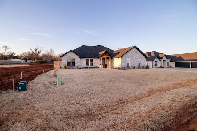 view of front of home with stone siding