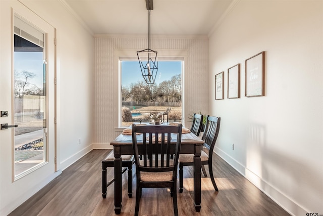 dining area with wallpapered walls, baseboards, and dark wood-type flooring