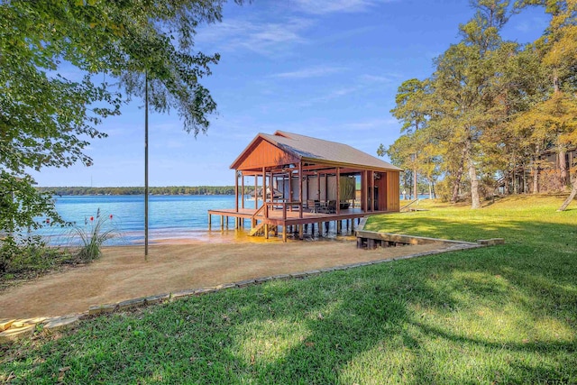 view of dock featuring a water view and a lawn