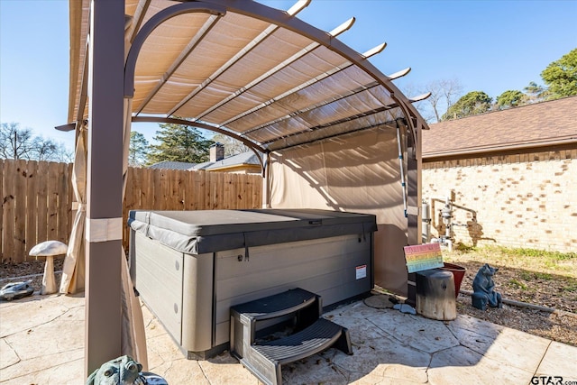 view of patio featuring a pergola and a hot tub