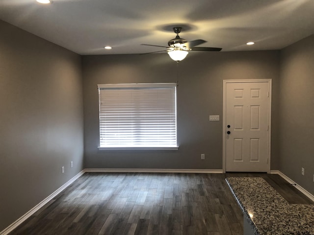 entryway featuring ceiling fan and dark hardwood / wood-style flooring