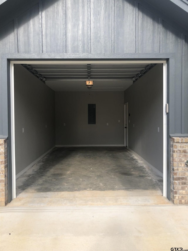 garage featuring a garage door opener and electric panel