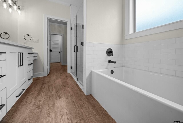 21488 Forest Pl, Flint, TX 75762 - full bath with a garden tub, wood finished floors, a shower stall, and vanity