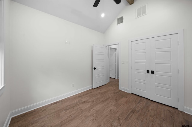21488 Forest Pl, Flint, TX 75762 - unfurnished bedroom featuring high vaulted ceiling, wood finished floors, a closet, beam ceiling, and a ceiling fan