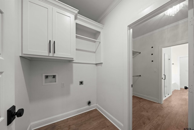 21488 Forest Pl, Flint, TX 75762 - washroom with ornamental molding, electric dryer hookup, washer hookup, dark wood-style floors, and cabinet space