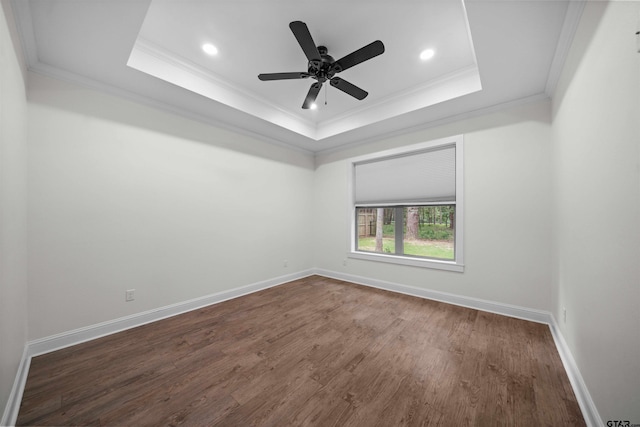 21488 Forest Pl, Flint, TX 75762 - unfurnished room with a tray ceiling, ornamental molding, dark wood-style flooring, a ceiling fan, and recessed lighting