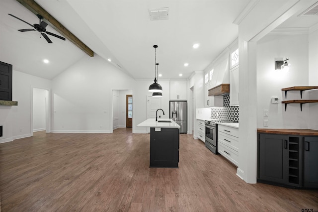 21488 Forest Pl, Flint, TX 75762 - kitchen with appliances with stainless steel finishes, ceiling fan, open floor plan, backsplash, and beam ceiling