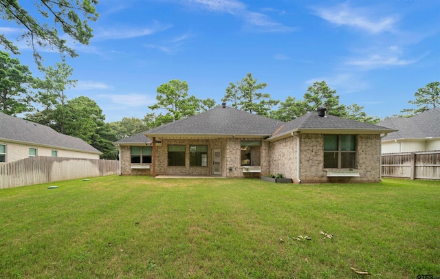 21488 Forest Pl, Flint, TX 75762 - back of house with a fenced backyard, brick siding, and roof with shingles