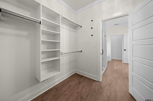 21488 Forest Pl, Flint, TX 75762 - spacious closet featuring dark wood-type flooring