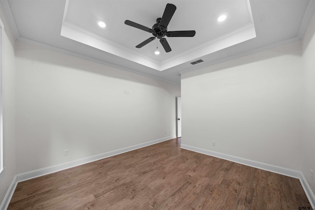 21488 Forest Pl, Flint, TX 75762 - unfurnished room with a raised ceiling, crown molding, wood finished floors, ceiling fan, and recessed lighting