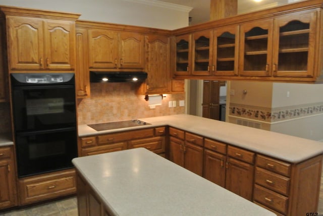 kitchen with black appliances, tasteful backsplash, and crown molding