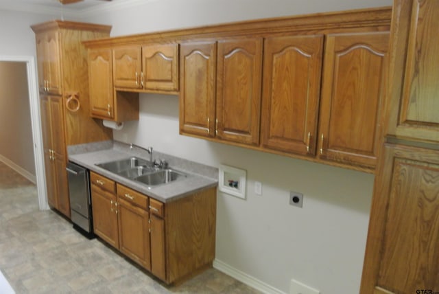 kitchen featuring stainless steel dishwasher, sink, and crown molding