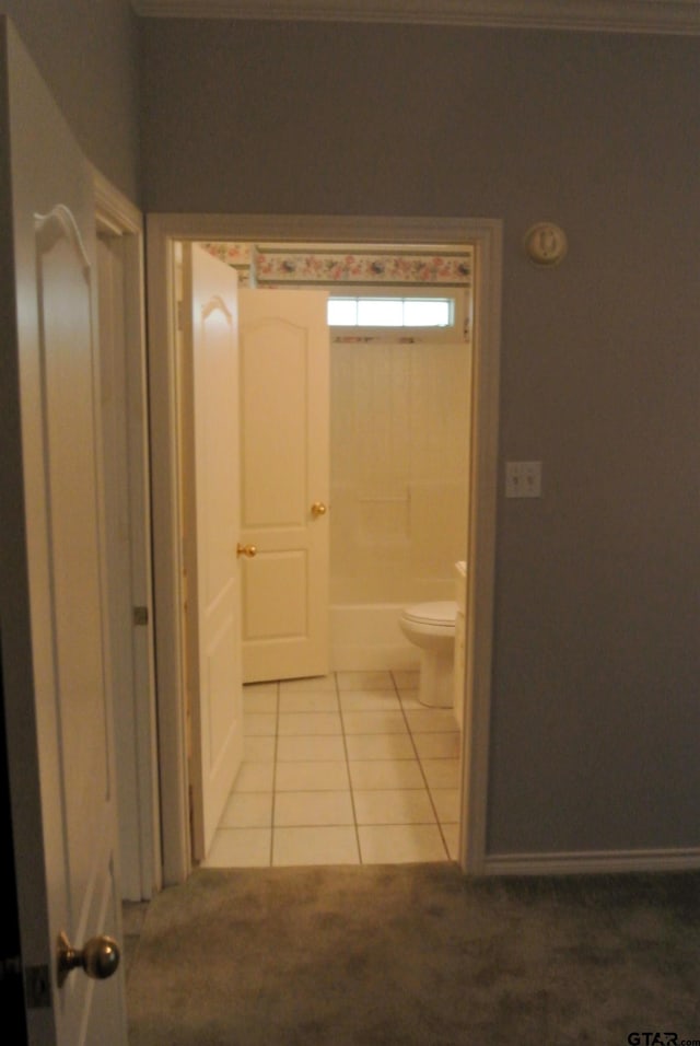 bathroom featuring tile patterned flooring and toilet