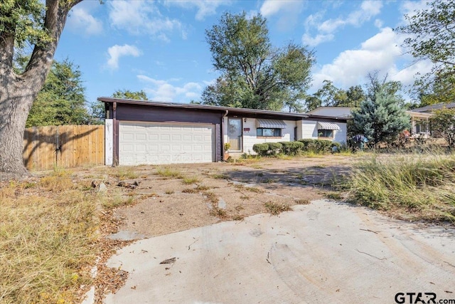 single story home featuring a garage