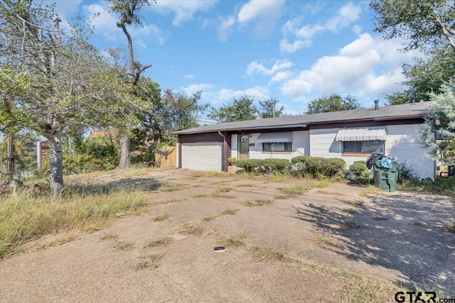 single story home featuring a garage