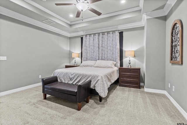 bedroom with ceiling fan, ornamental molding, a raised ceiling, and carpet floors