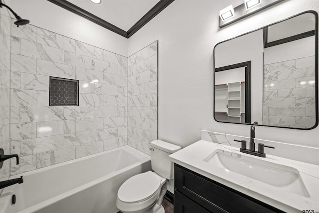 full bathroom featuring vanity, tiled shower / bath combo, toilet, and crown molding