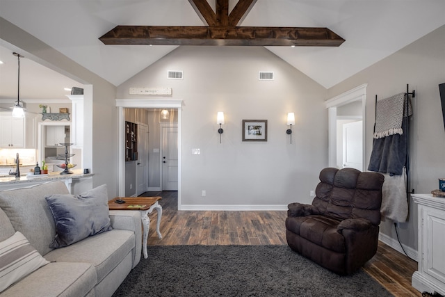 living room featuring dark hardwood / wood-style flooring and lofted ceiling with beams