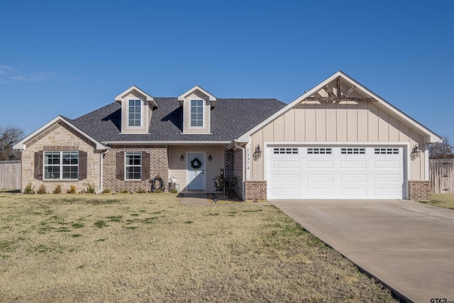 view of front of house featuring a garage and a front yard