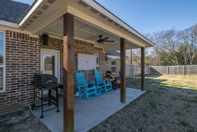 view of patio featuring a grill and ceiling fan