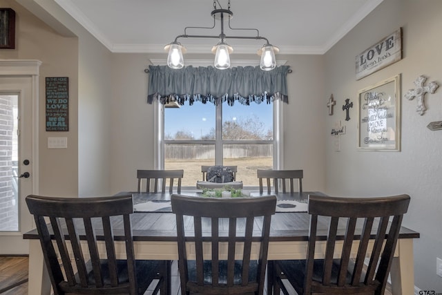 dining room featuring ornamental molding