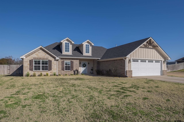 view of front of home with a garage and a front yard