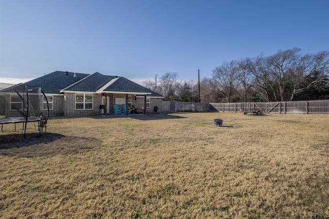 view of yard with a trampoline